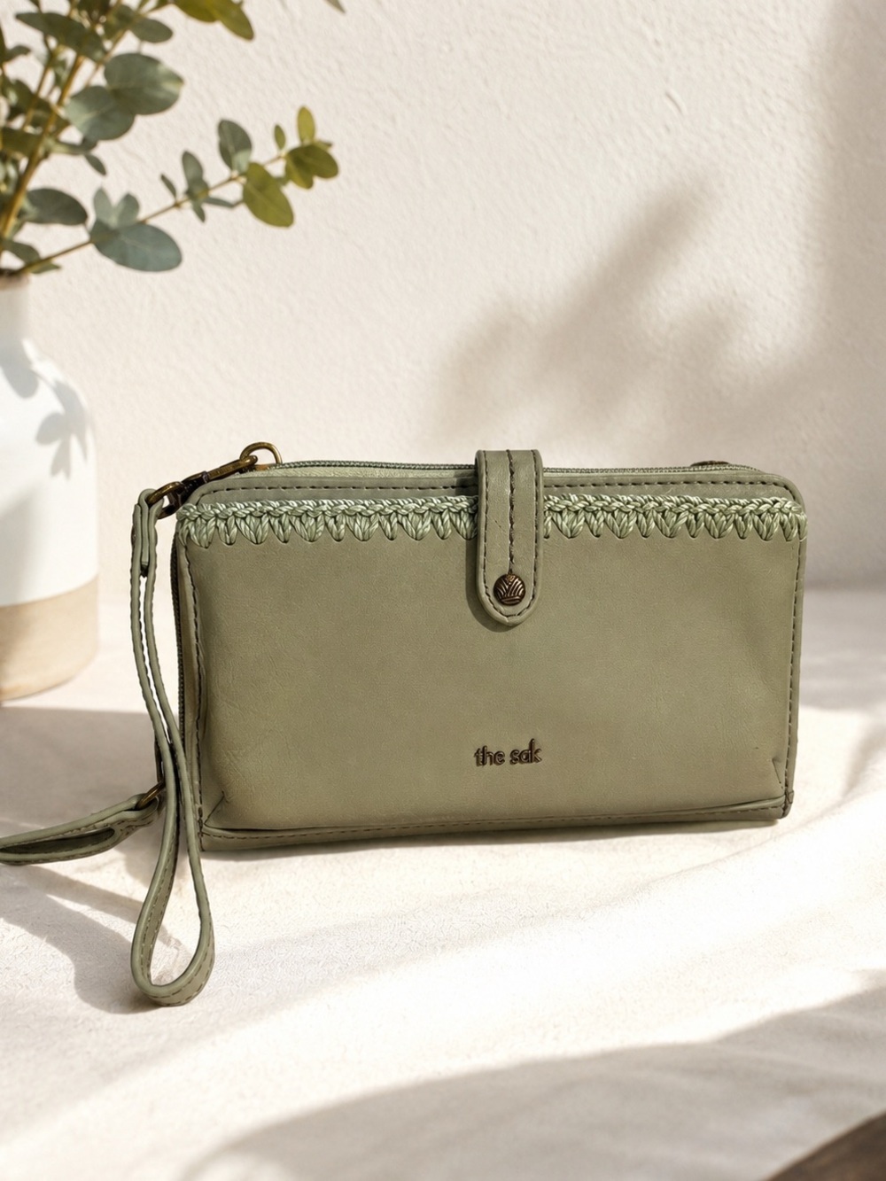 The Sak Iris Smartphone Wristlet wallet Sage Green meadow leather